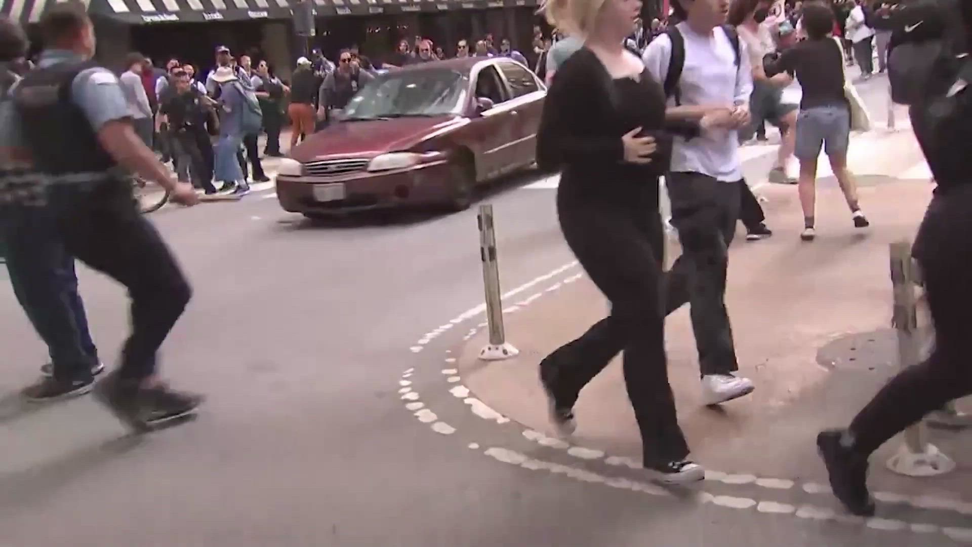 Car plows through crowd of anti-ICE protesters in Chicago